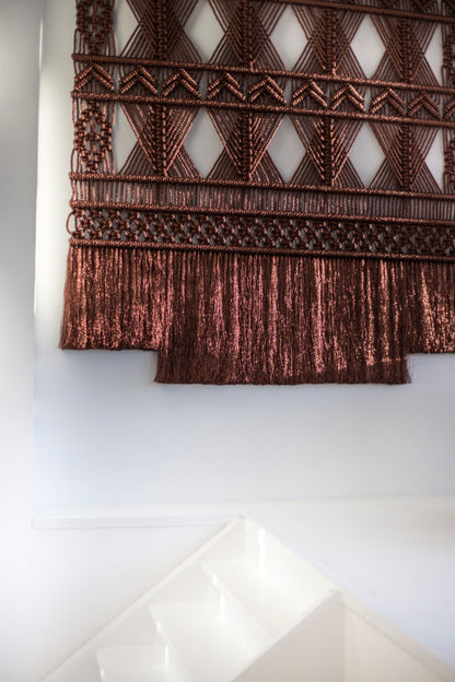 Close-up of the shimmering copper-brown two-tier fringe and knotted diamonds